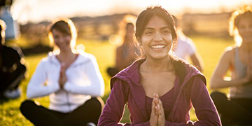 women practise yoga