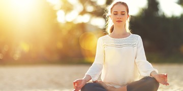 Woman practises mindfulness mediation
